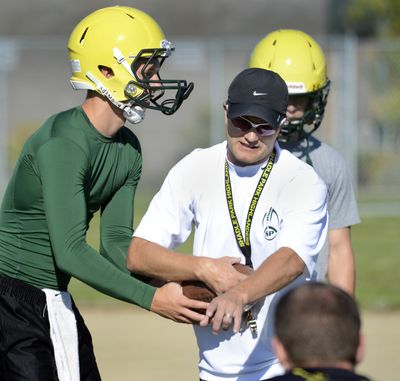 Alan Stanfield, working with Brett Rypien, is leaving Shadle Park for the Whitworth staff. (Dan Pelle)
