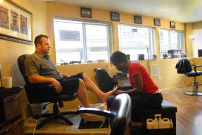
John Guarisco receives a pedicure from Yolanda Anderson at the Men's Room. 
 (Brian Plonka / The Spokesman-Review)
