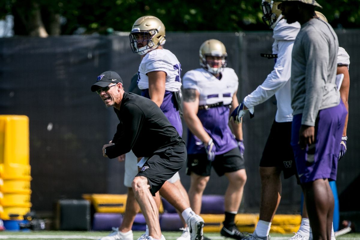 Huskies linebackers coach Bob Gregory instructs a drill during football practice at Husky Stadium, on August 6, 2018.   (Rebekah Welch/The Seattle Times)