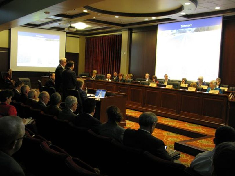 Idaho transportation officials including Chief Engineer Tom Cole and Deputy Director Scott Stokes make a presentation to a joint meeting of the House and Senate transportation committees. (Betsy Russell)