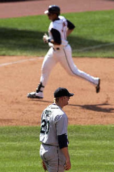 
Seattle reliever J.J. Putz waits while Victor Martinez circles the bases after a 3-run homer.
 (Associated Press / The Spokesman-Review)