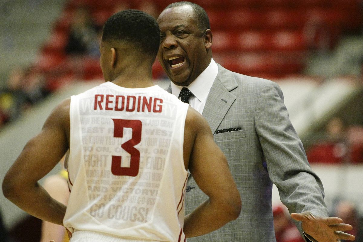 Washington State first-year head coach Ernie Kent talks with guard Ny Redding during a timeout in the California game in January, which the Cougars lost 76-67. (Associated Press)