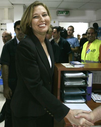 Israeli Foreign Minister Tzipi Livni is greeted  after voting  in Tel Aviv, Israel, on Wednesday.  (Associated Press / The Spokesman-Review)