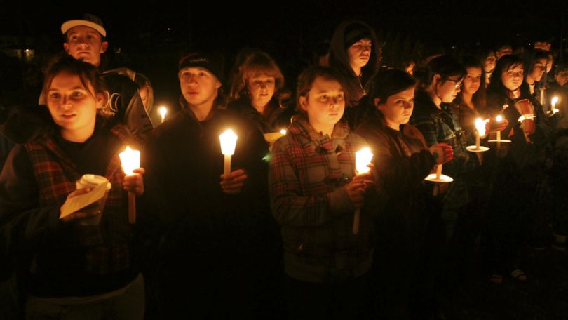 In this Jan. 15, 2010 photo, a candlelight vigil is held at South Hadley, Mass., High School for freshman Phoebe Prince, 15, originally from Ireland, who had killed herself the previous day. On Monday, March 29, 2010, nine teens were charged in the 