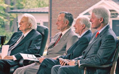 
Former presidents, from right, Bill Clinton, Jimmy Carter and George H.W. Bush look on with the Rev. Billy Graham during a dedication for the Graham library. 
 (Associated Press / The Spokesman-Review)