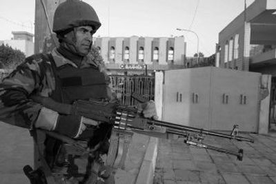 
An Iraqi soldier guards the governor's office compound Friday in Karbala, Iraq.  Four U.S. soldiers were abducted Jan. 20 after repelling an attack and later executed. 
 (Associated Press / The Spokesman-Review)
