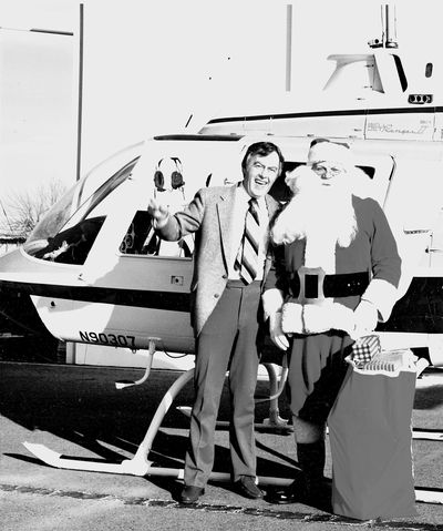 Announcer Art MacKelvie of Spokane Valley’s KZUN radio station poses with Santa in the mid-1970s.