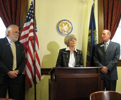 Rep. Janie Ward-Engleking speaks at a news conference in the state Capitol on Wednesday; at left is Rep. Hy Kloc, D-Boise; at right is Sen. Elliot Werk, D-Boise (Betsy Russell)