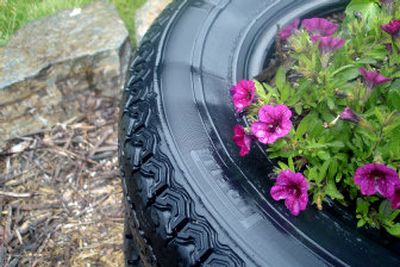 
Colorful annuals are planted in recycled tires at the Bonner County Master Gardeners Learning Garden.
 (Photo courtesy of Carolyn Lamberson / The Spokesman-Review)