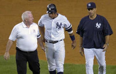 Yankees' Alex Rodriguez, center, leaves the field after an injury on Monday. Associated Press
(Associated Press / The Spokesman-Review)