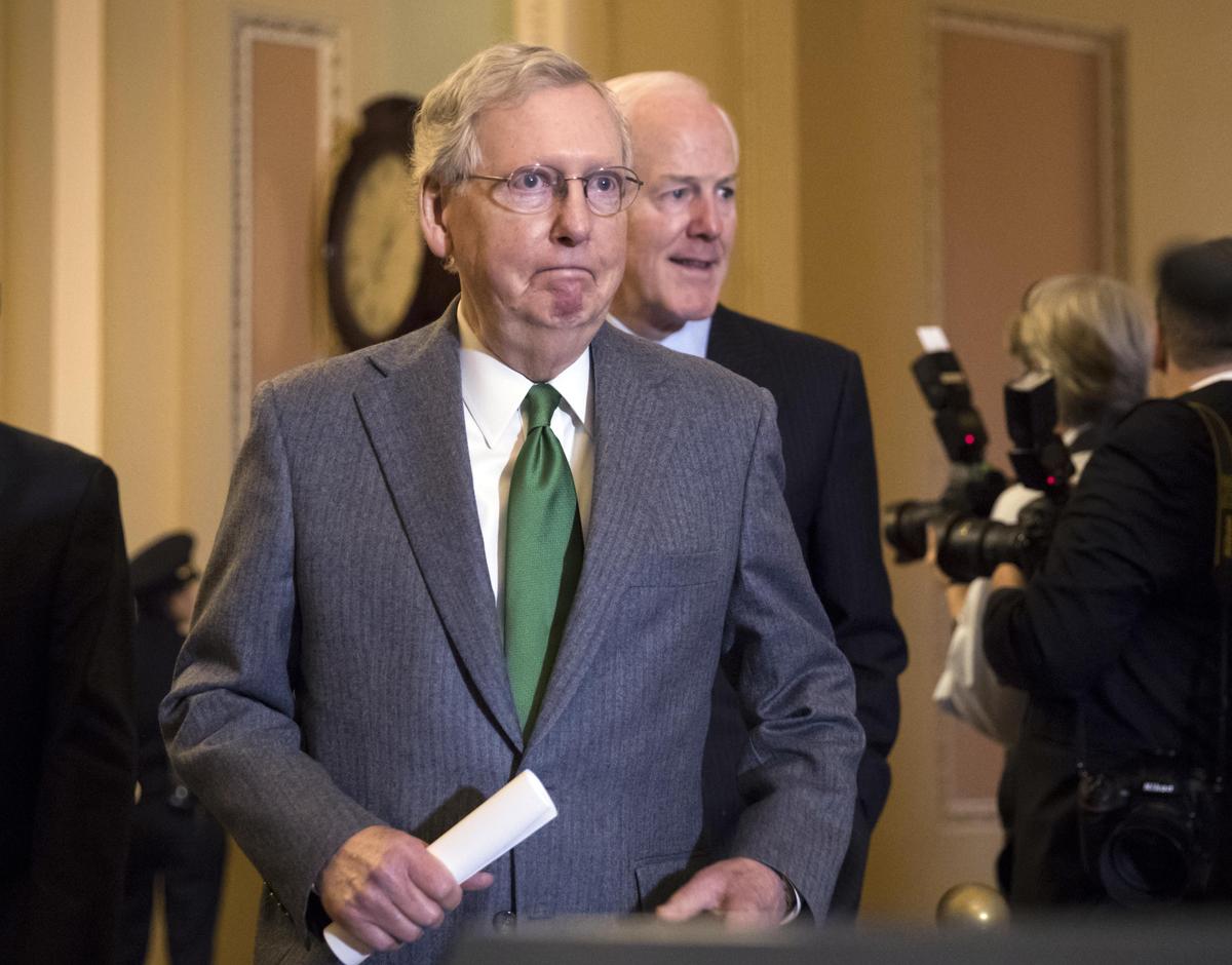Senate Majority Leader Mitch McConnell, R-Ky., and Majority Whip John Cornyn, R-Texas, right, arrive to speak to reporters following a closed-door strategy session that included Vice President Mike Pence, on Capitol Hill in Washington, Tuesday, Nov. 7, 2017. (J. Scott Applewhite / Associated Press)