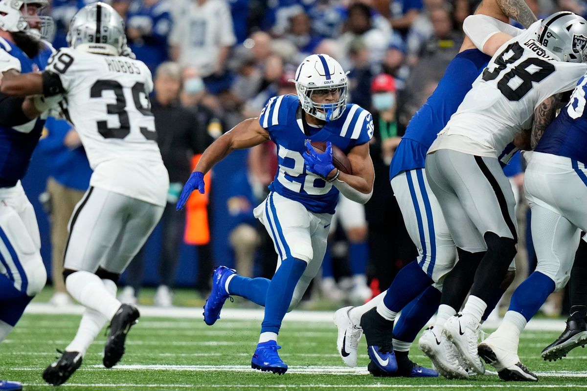 Indianapolis Colts running back Jonathan Taylor (28) carries the ball up field during the second half of an NFL football game against the Las Vegas Raiders, Sunday, Jan. 2, 2022, in Indianapolis.  (AJ Mast)