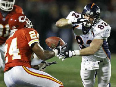 
Chiefs'  Ty Law (24) intercepts a pass against the Broncos. 
 (Associated Press / The Spokesman-Review)