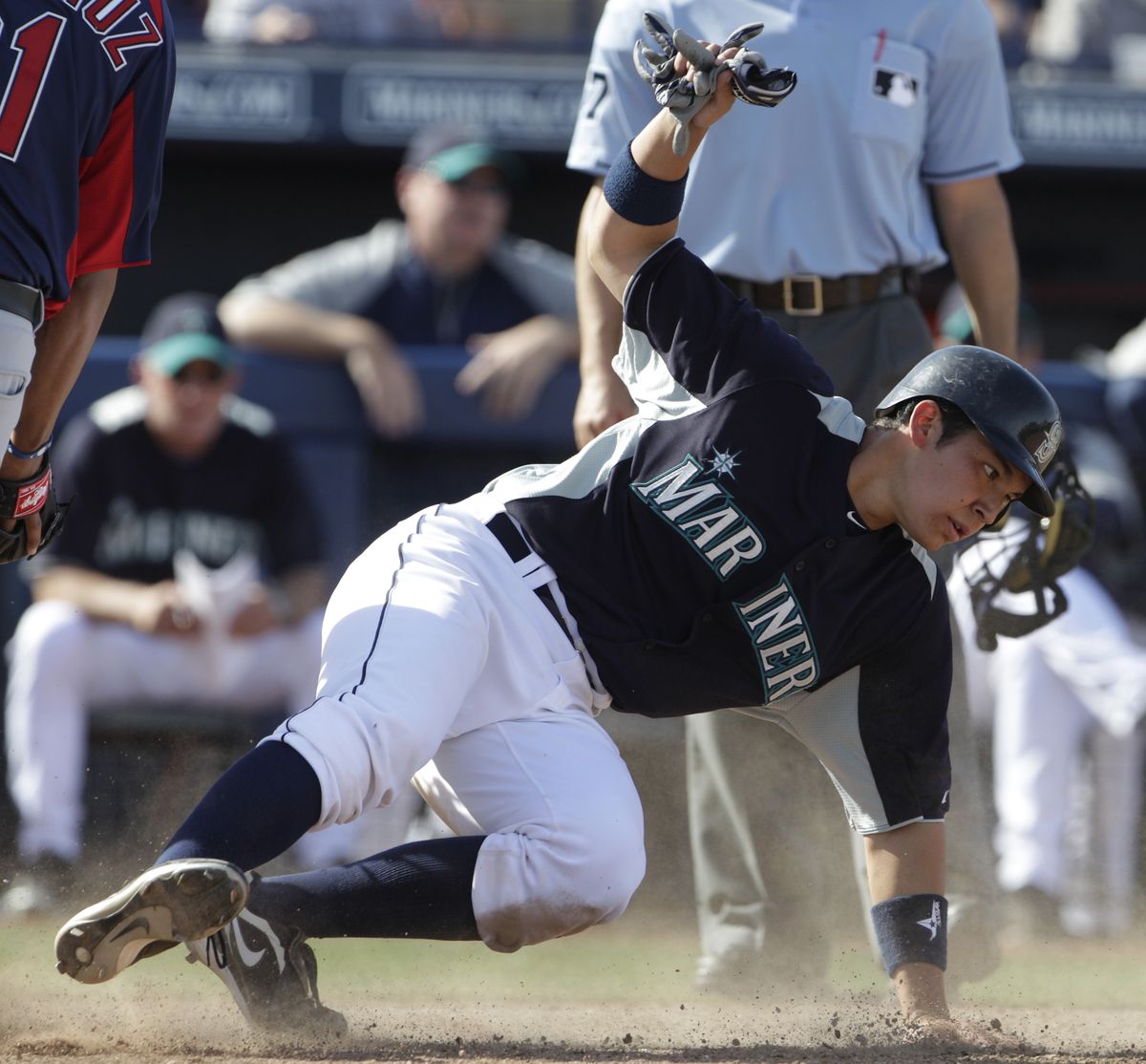 Steven Baron slides in safely while scoring on a wild pitch in Saturday’s game against Cleveland. (Associated Press)