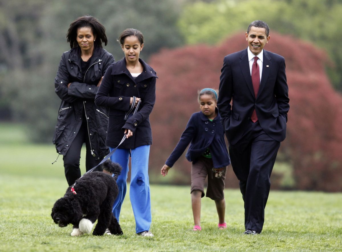 April 14:  Malia Obama walks with her family’s dog, Bo, followed by President  Obama, Sasha Obama and Michelle Obama at the White House. (The Spokesman-Review)