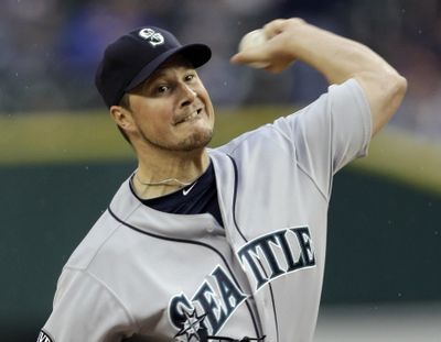 Seattle Mariners starting pitcher Erik Bedard  throws against the Detroit Tigers in the first inning of a baseball game in Detroit, Wednesday, April 27, 2011. (Paul Sancya / Associated Press)