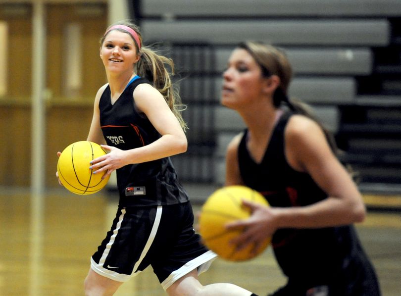 Defending State 4A champion Lewis and Clark returns Julia Moravec, left, and Devyn Galland. (Jesse Tinsley)