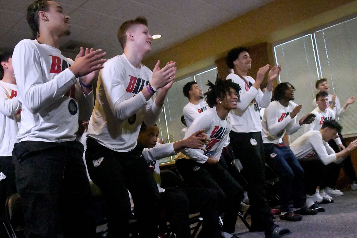 The team reacts at McCarthey Athletic Center during Sunday’s NCAA Tournament Selection Show.  (Kathy Plonka/The Spokesman-Review)