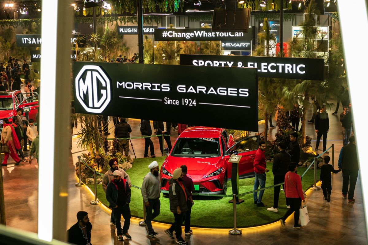 People visit the MG Motor booth Jan. 13 at the India Auto Expo 2023 in Noida, India.   (Anindito Mukherjee/Bloomberg)