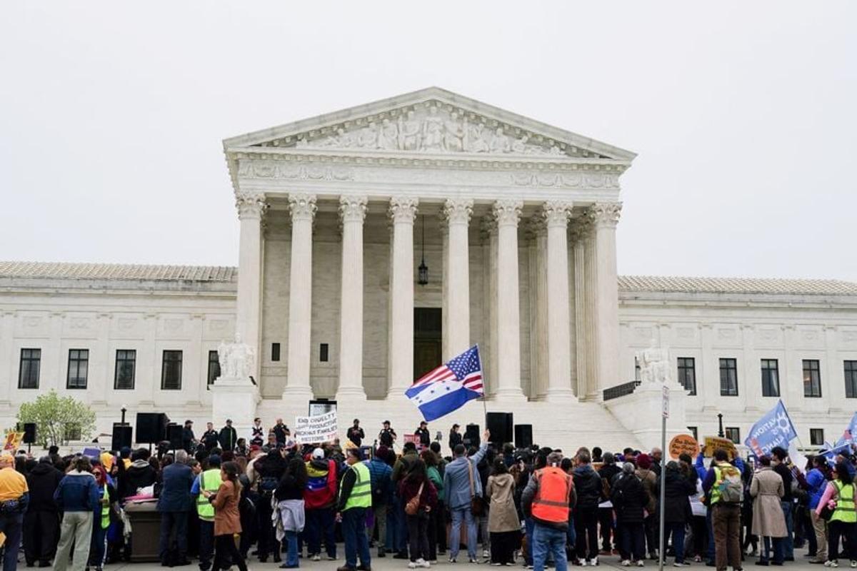 Immigrants’ rights activists and demonstrators attend a rally outside the U.S. Supreme Court in Washington, D.C., on April 29 as justices were scheduled to hear arguments on whether the administration of President Donald Trump can end the temporary protected status of Syrian and Haitian nationals.  (Reuters )