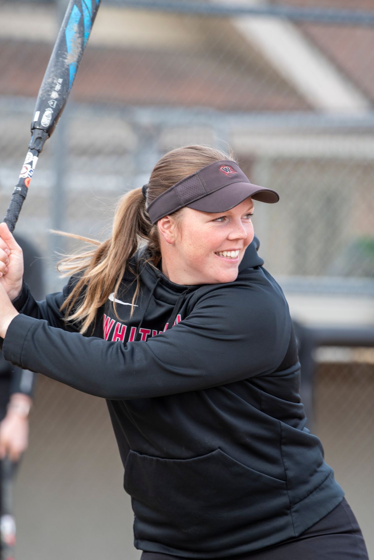 The Whitworth Pirates’ Maddy Thomas takes batting practice during practice Wednesday, April 20, 2022 as the the team prepares for their conference playoffs. Thomas is a catcher but is injured, so she is doing a lot of coaching, while also preparing to be their designated player and hit. Thomas, a senior, is also on the cusp of being Whitworth’s all-time home run hitter.  (Jesse Tinsley/THE SPOKESMAN-REVI)