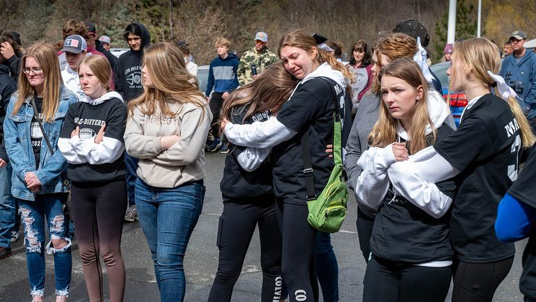Colville High School students and members of the community gather Saturday outside of Providence Mount Carmel Hospital to grieve the loss of Dale Martin, who was being taken off life support and having his organs donated after he suffered a traumatic football injury April 1. (COLIN MULVANY/THE SPOKESMAN-REVI)
