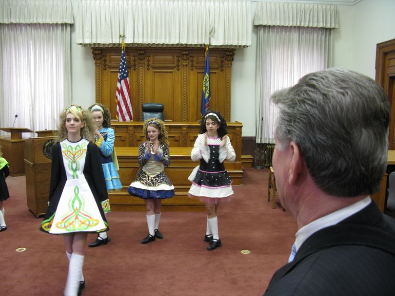 Gov. Butch Otter enjoys a performance of an Irish reel by young dancers, as he declares 
