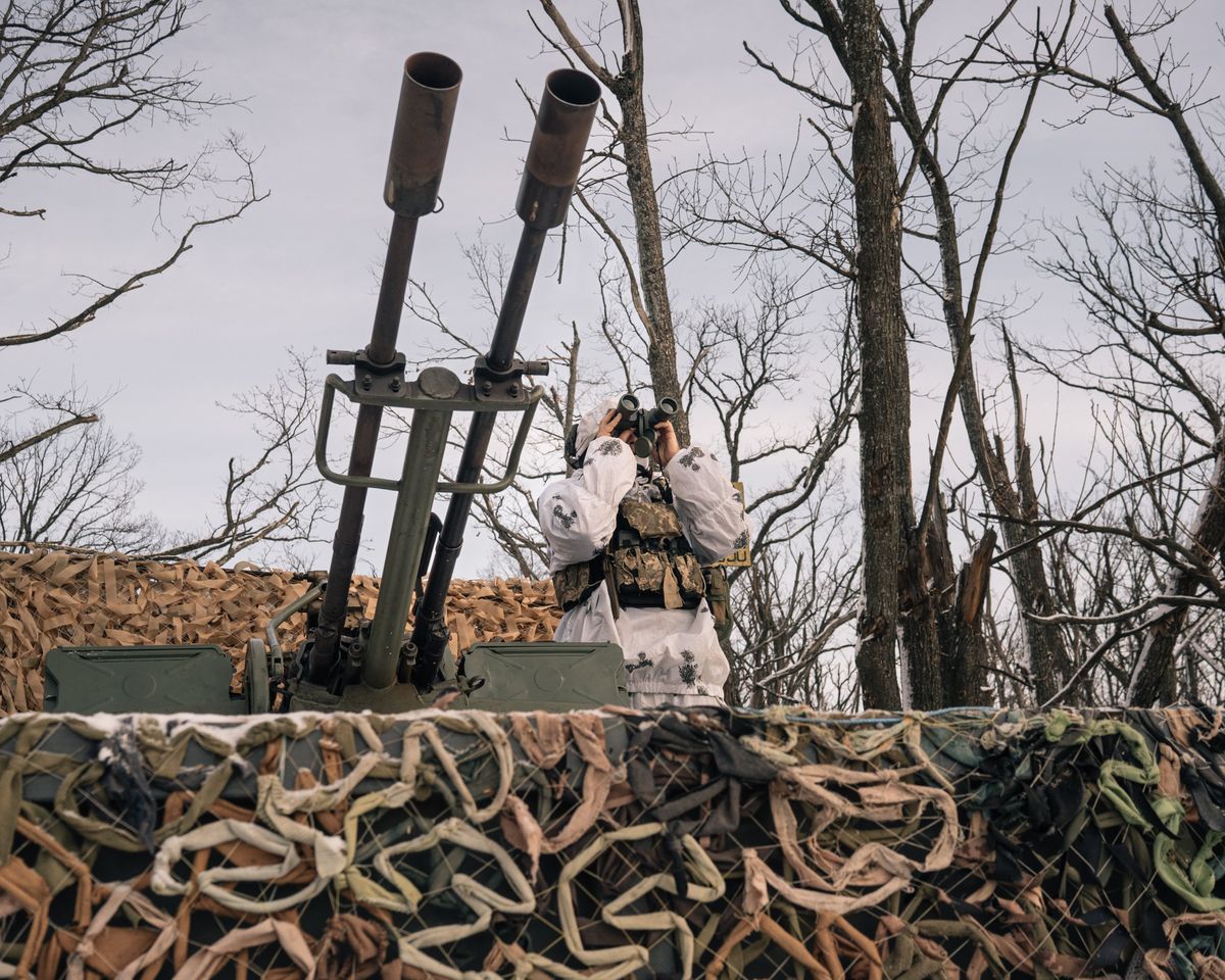 A member of a Ukrainian air defense unit in the woods north of Kharkiv, Ukraine, on Tuesday.    (Alice Martins for The Washington Post)