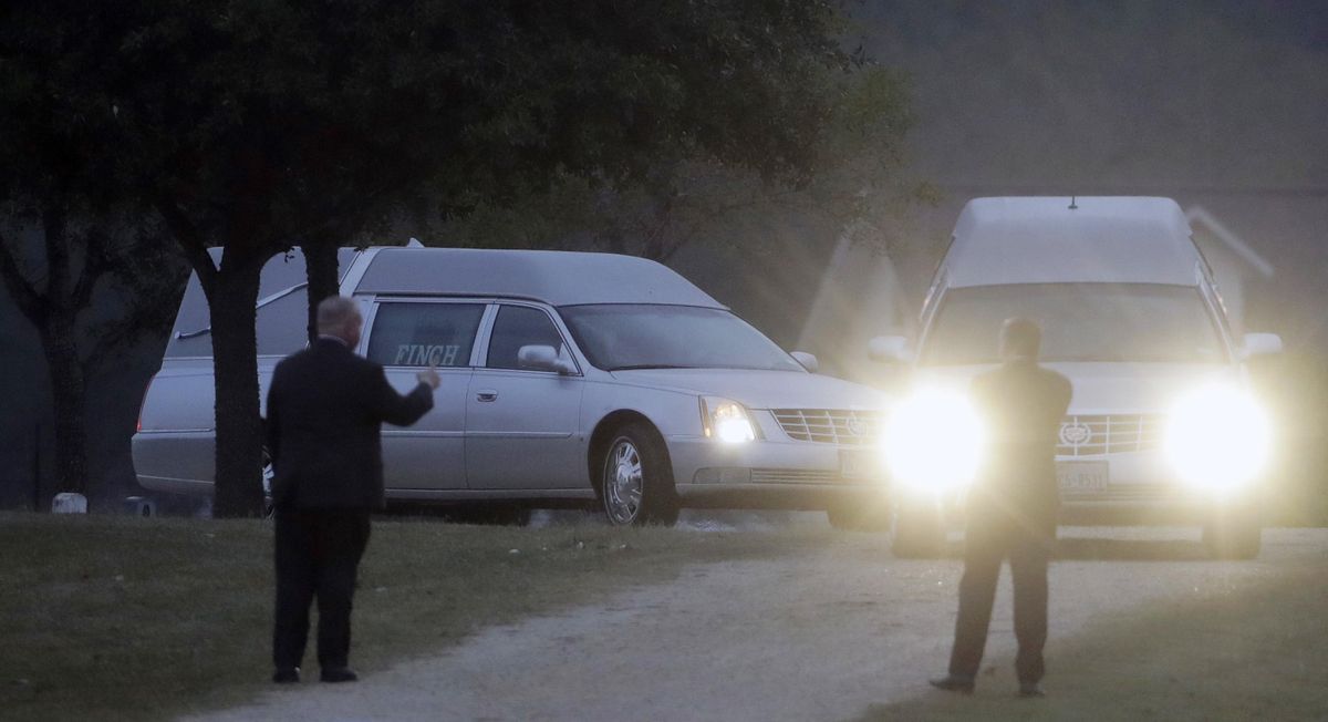 Two hearses arrive with the caskets of Richard and Therese Rodriguez at the Sutherland Springs Cemetery, Saturday, Nov. 11, 2017, in Sutherland Springs, Texas. The two were killed when a man opened fire inside the Sutherland Springs First Baptist church on Sunday. (Eric Gay / Associated Press)