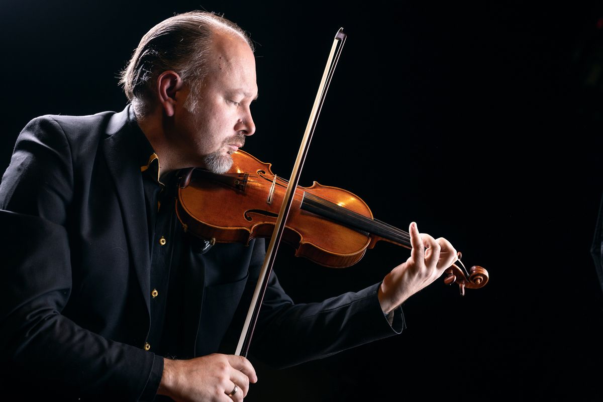Spokane Symphony concertmaster Mateusz Wolski is a soloist on violin for this weekend’s two symphony concerts at Martin Woldson Theater at the Fox.  (Colin Mulvany/The Spokesman-Review)