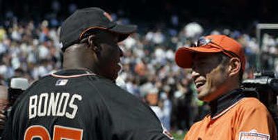 
San Francisco's Barry Bonds and Seattle's Ichiro Suzuki share a laugh on Monday. Associated Press
 (Associated Press / The Spokesman-Review)