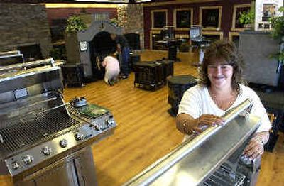 
Kristy Petersen  works at About the Home, a new fireplace, heating stove and appliance store in Post Falls. 
 (Jesse Tinsley / The Spokesman-Review)