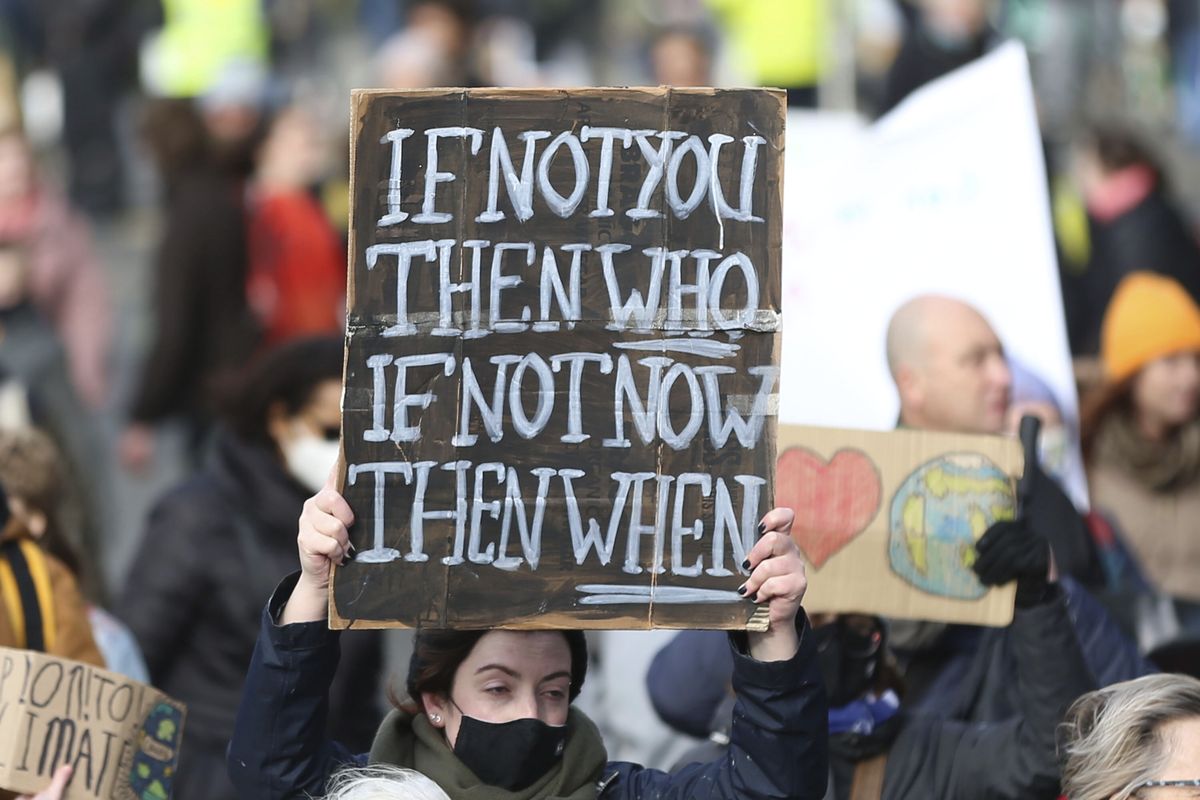 Climate activists attend a protest in Dublin, Ireland, Saturday, Nov. 6, 2021. The protest was taking place as leaders and activists from around the world were gathering in Scotland