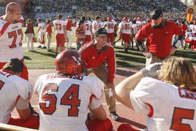 
EWU football coach Paul Wulff, center, sees good days ahead. Associated Press
 (Associated Press / The Spokesman-Review)