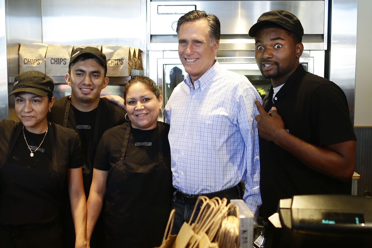 Republican presidential candidate, former Massachusetts Gov. Mitt Romney poses for a photo with workers as he makes an unscheduled stop at a Chipotle restaurant in Denver, Tuesday, Oct. 2, 2012. (Charles Dharapak / Associated Press)
