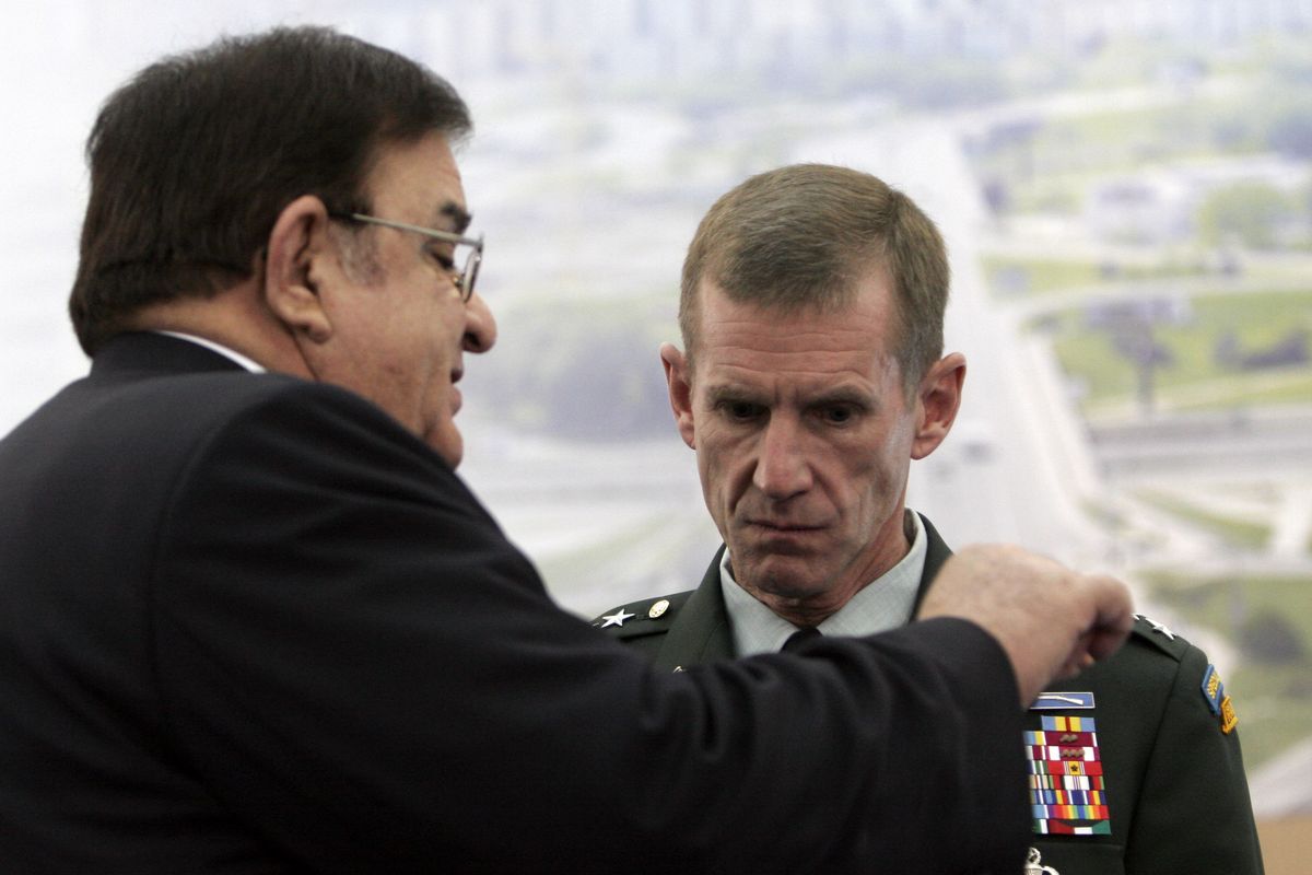 Afghanistan’s Defense Minister Abdul Rahim Wardak, left, speaks with U.S. Commander of Forces in Afghanistan Gen. Stanley McChrystal during a meeting of NATO defense ministers in  Slovakia on Friday. (The Spokesman-Review)