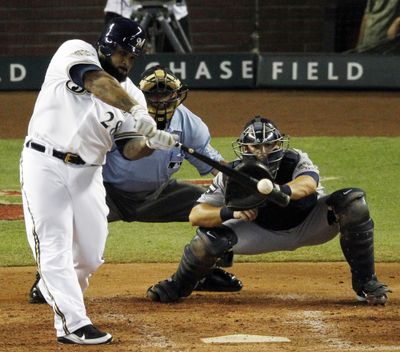 Prince Fielder of the Milwaukee Brewers swats a three-run home run in the fourth inning on Tuesday. (Associated Press)