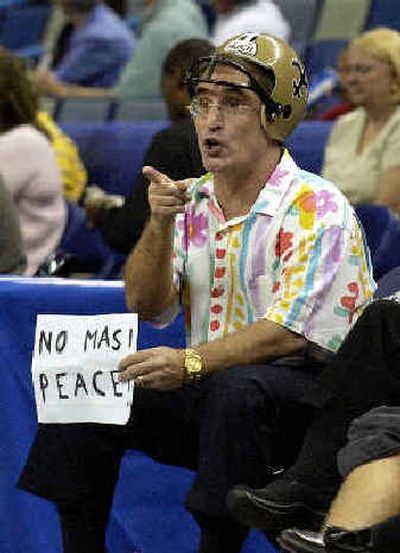 After the events of last night's NBA game between the Pacers and the Pistons, Michael Meyer came prepared to watch the Hornets host the Timberwolves.
 (Associated Press / The Spokesman-Review)