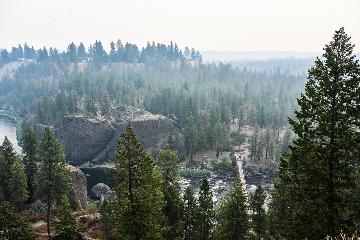 A layer of smoke settles over the Bowl and Pitcher in Riverside State Park on Monday in north Spokane.  (DAN PELLE/THE SPOKESMAN-REVIEW)