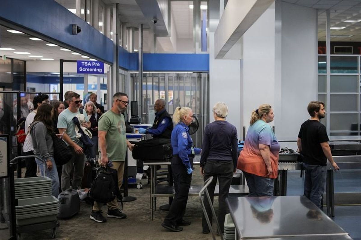 Travelers pass through a TSA security screening on October 1 at Hollywood Burbank Airport during the first day of a partial U.S. government shutdown in Burbank, California.  (Daniel Cole/Reuters)