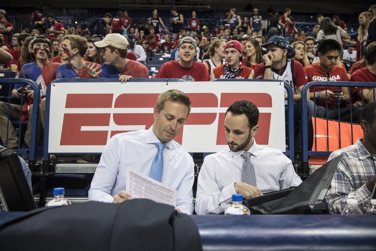 ESPN announcers Sean Farnham and Eric Rothman review notes before the start of the Gonzaga-San Diego State game, Nov. 14, 2016, in the McCarthey Athletic Center. (Dan Pelle / The Spokesman-Review)