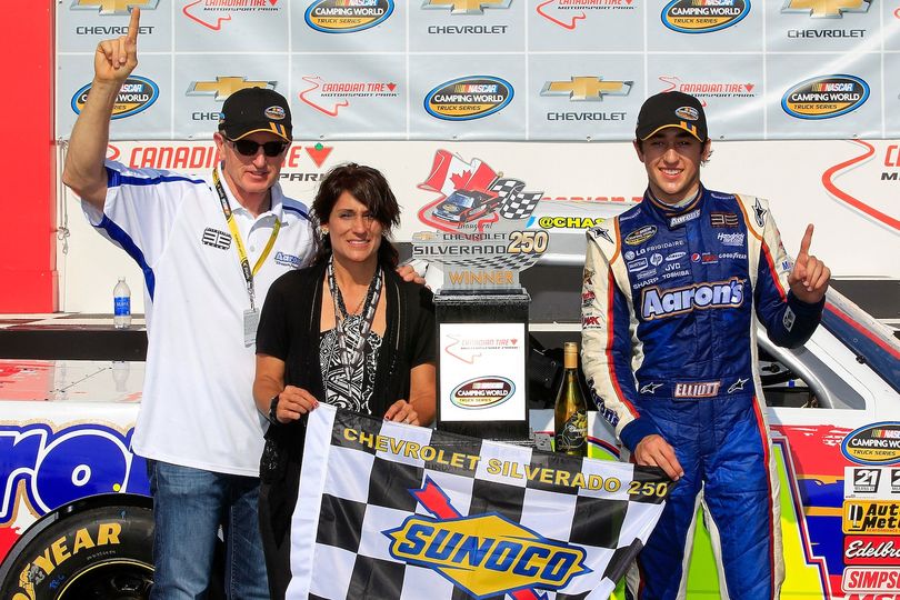 Chase Elliott ( r ), driver of the #94 Aaron's Dream Machine/Hendrickcars.com Chevrolet, celebrates in victory lane with his father, Bill ( l ), and mother Cindy ( m ), after winning the NASCAR Camping World Truck Series Chevrolet Silverado 250 at Canadian Tire Motorsport Park on September 1, 2013 in Bowmanville, Canada. (Photo Credit: Geoff Burke/NASCAR via Getty Images) (Geoff Burke / Nascar)