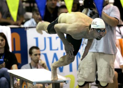 Michael Phelps dives at the start of his men’s 200-meter freestyle preliminary at the Charlotte (N.C.) UltraSwim.  (Associated Press / The Spokesman-Review)