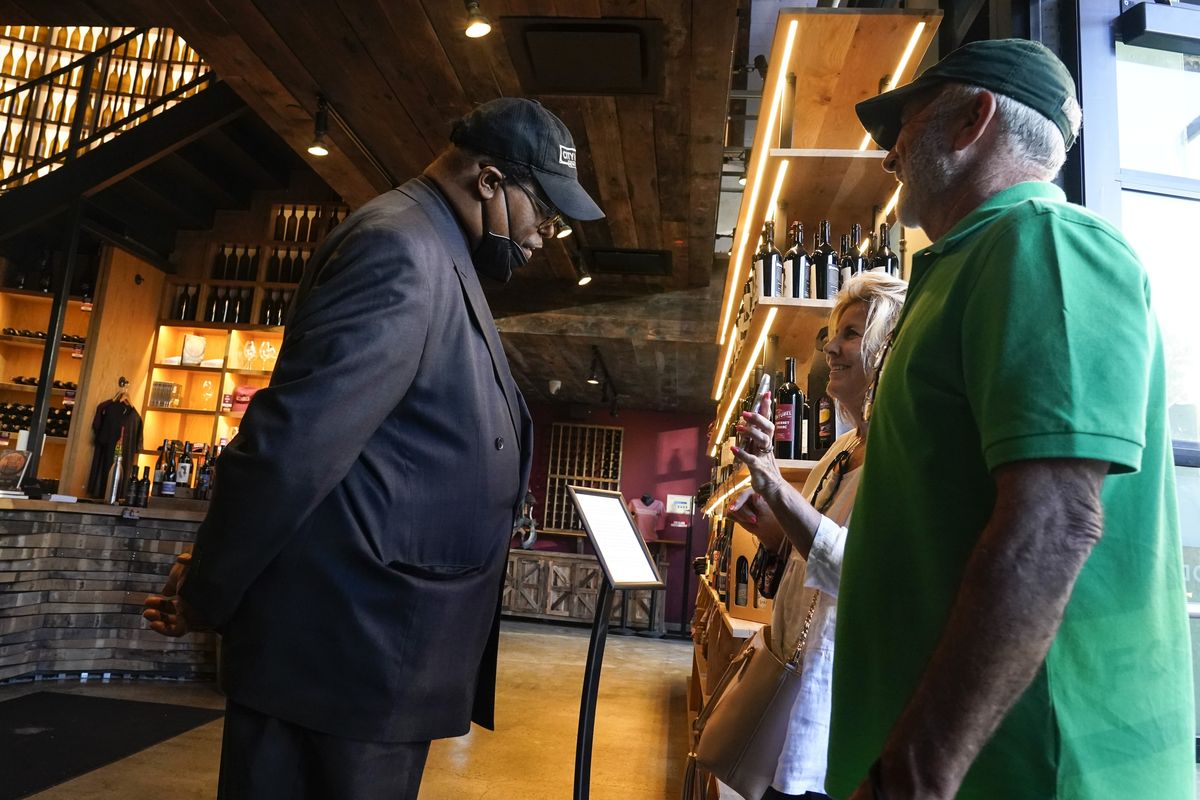Security personnel ask customers for proof of vaccination as they enter City Winery, Thursday, June 24, 2021, in New York. Customers wanting to wine, dine and unwind to live music at the City Winery