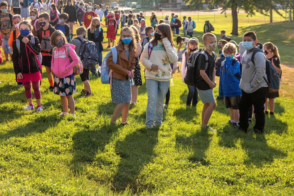 Students line up for the first day of the 2021-2022 school year at Salnave Elementary School on Wednesday, Sept. 1. Students are masked and in-person for classroom learning in the Cheney Public School District.  (Libby Kamrowski/ THE SPOKESMAN-R)