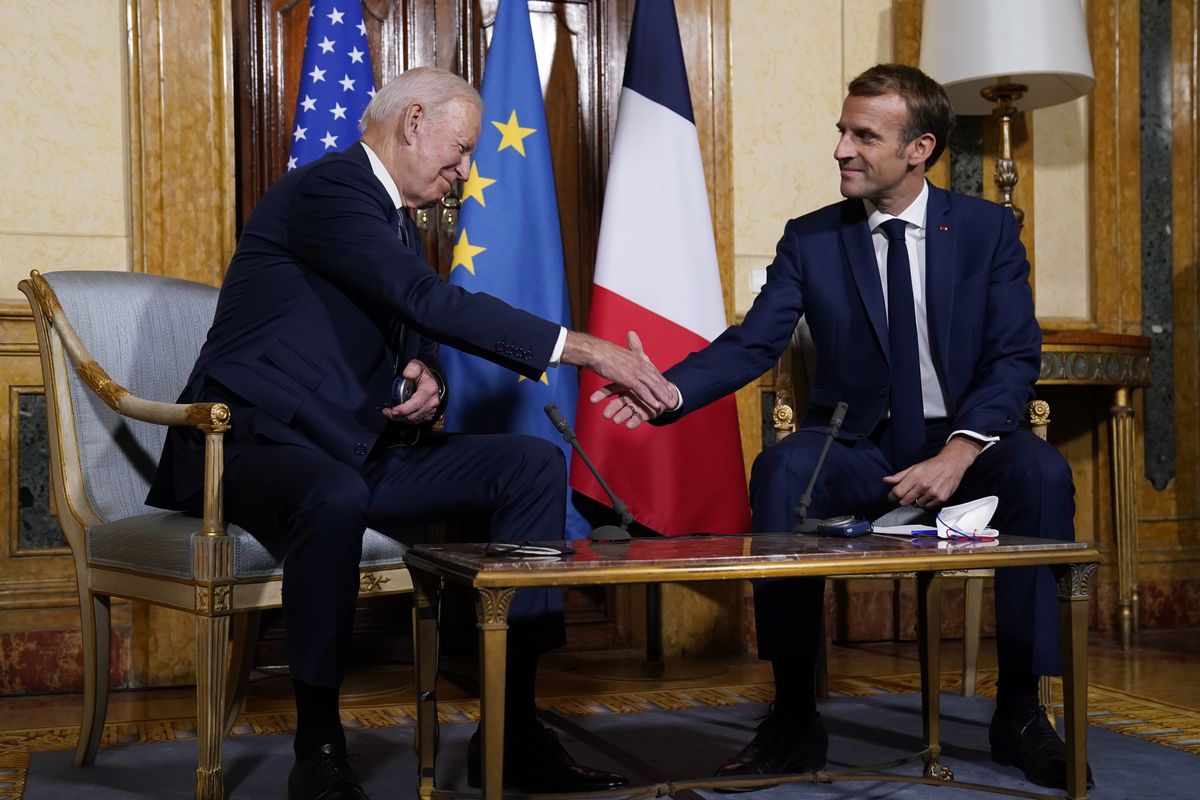 U.S. President Joe Biden, left, shakes hands with French President Emmanuel Macron during a meeting at La Villa Bonaparte in Rome, Friday, Oct. 29, 2021. A Group of 20 summit scheduled for this weekend in Rome is the first in-person gathering of leaders of the world