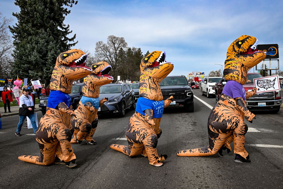 During the No Kings 3.0 protest, Dinos against ICE cross Division at Garland Avenue to join an overflow crowd lining the east side of North Division Street. (COLIN MULVANY /THE SPOKESMAN-REVIEW)