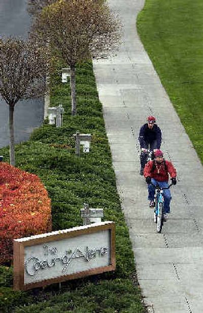 
Bicyclists ride through the greenspace in front of the Coeur d'Alene Resort.
 (Jesse Tinsley / The Spokesman-Review)