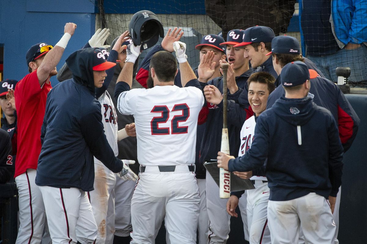Gonzaga’s Jake Vieth is greeted by teammates Tuesday after hitting a solo homer in the  fourth inning against visiting Washington State. (Colin Mulvany / The Spokesman-Review)