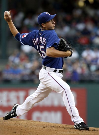 Rangers starter  Derek Holland took a one-hitter into the ninth inning.  (Associated Press / The Spokesman-Review)